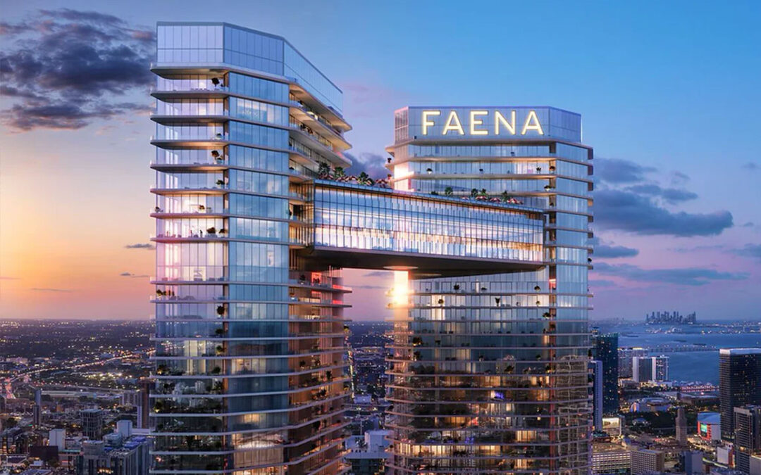 Faena Residences luxury towers in Miami at sunset, with modern architectural design, palm trees and river view.