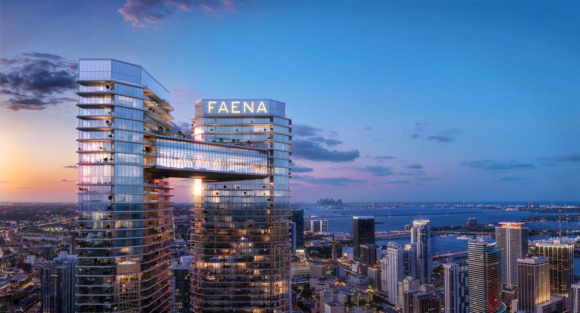 Faena Residences luxury towers in Miami at sunset, with modern architectural design, palm trees and river view.